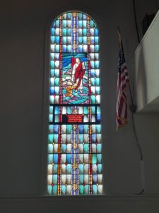 Church window & American flag
